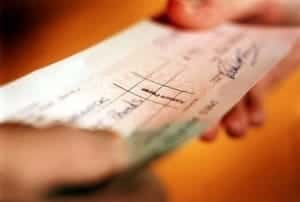 Roofers giving cheque to pensioner